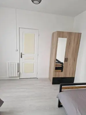 Un ou plusieurs lits dans un hébergement de l'établissement Appart 10 minutes de rouen