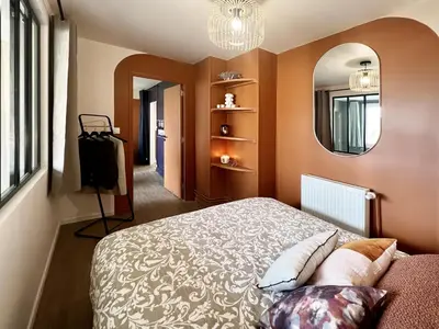 Un ou plusieurs lits dans un hébergement de l'établissement L'Arc-en-Ciel Scandinave - Séjour unique et design au cœur de Rouen
