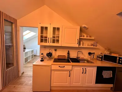 Cuisine ou kitchenette dans l'établissement Lecomte