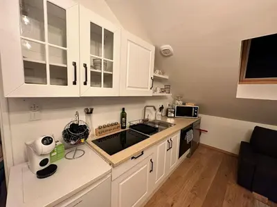 Cuisine ou kitchenette dans l'établissement Lecomte