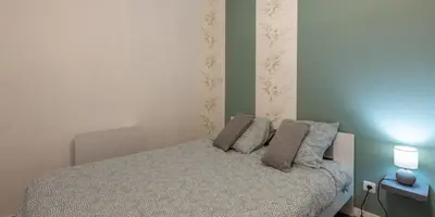 Un ou plusieurs lits dans un hébergement de l'établissement Appartement rénové tout confort