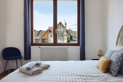 Un ou plusieurs lits dans un hébergement de l'établissement L'impasse - Maison avec jardin proche du centre