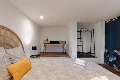 Un ou plusieurs lits dans un hébergement de l'établissement L'impasse - Maison avec jardin proche du centre