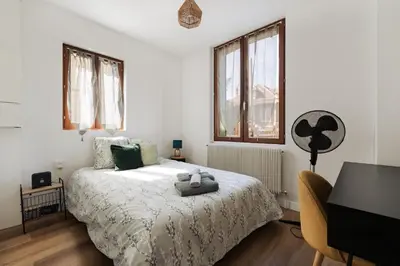 Un ou plusieurs lits dans un hébergement de l'établissement L'impasse - Maison avec jardin proche du centre