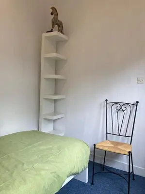 Un ou plusieurs lits dans un hébergement de l'établissement Appartement duplex de charme