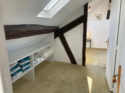Un ou plusieurs lits dans un hébergement de l'établissement Appartement duplex de charme