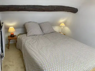 Un ou plusieurs lits dans un hébergement de l'établissement Appartement duplex de charme