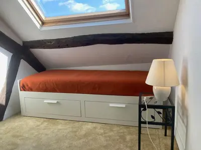 Un ou plusieurs lits dans un hébergement de l'établissement Appartement duplex de charme