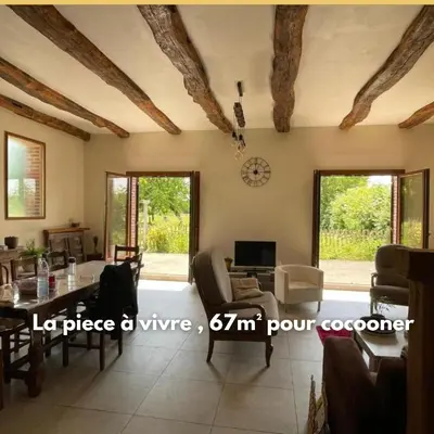 Coin salon dans l'établissement Grange normande XIXe Salon cathédrale & cheminée jardin 5000m 10 pers