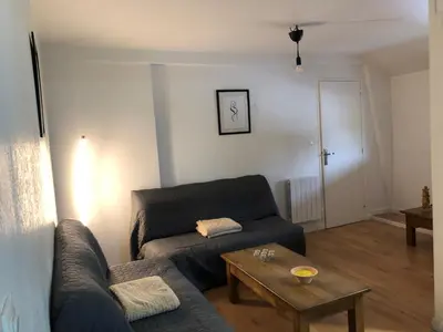 Coin salon dans l'établissement Appartement atypique