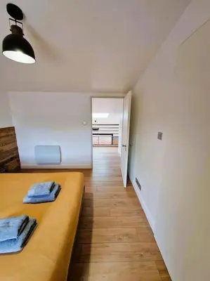 Un ou plusieurs lits dans un hébergement de l'établissement Le Bellay ¤ 2 Chambres ¤ Cour ¤10 mins Centre¤