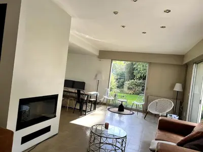 Télévision ou salle de divertissement dans l'établissement La Lumineuse du Moulin