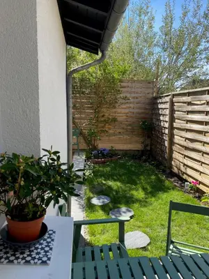 Jardin de l'établissement Maison cosy rénovée avec jardin