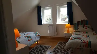 Un ou plusieurs lits dans un hébergement de l'établissement Le GITE DU VILLAGE