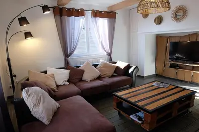 Coin salon dans l'établissement Le GITE DU VILLAGE