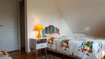 Un ou plusieurs lits dans un hébergement de l'établissement Le GITE DU VILLAGE