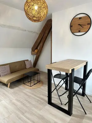 Coin salon dans l'établissement Appartements Pacy-sur-Eure