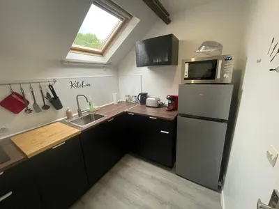Cuisine ou kitchenette dans l'établissement Le Dortoir Daubigny
