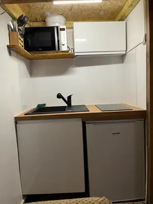 Cuisine ou kitchenette dans l'établissement Lilliputiens