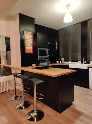 Cuisine ou kitchenette dans l'établissement Coeur de ville