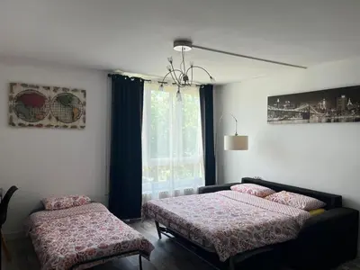 Un ou plusieurs lits dans un hébergement de l'établissement Appartement équipé proche aéroport et gare