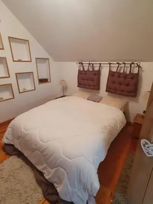 Un ou plusieurs lits dans un hébergement de l'établissement Maison spacieuse