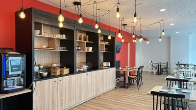 Restaurant ou autre lieu de restauration dans l'établissement Nemea Appart Hotel Coliseum Amiens Centre