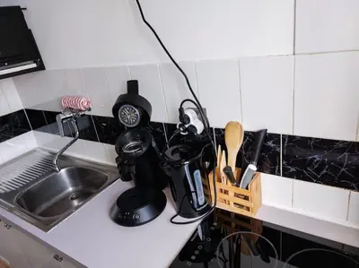 Cuisine ou kitchenette dans l'établissement Le Sympathique