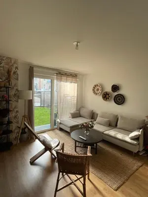 Coin salon dans l'établissement Appartement de charme Poissy