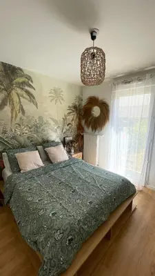Un ou plusieurs lits dans un hébergement de l'établissement Appartement de charme Poissy