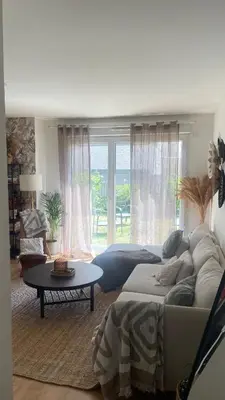 Coin salon dans l'établissement Appartement de charme Poissy