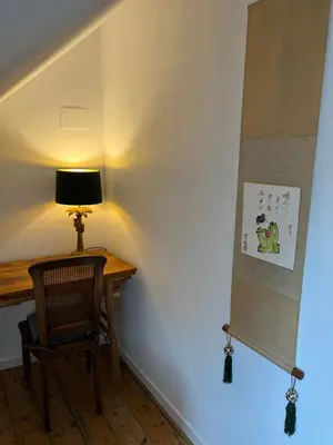 Télévision ou salle de divertissement dans l'établissement Maison K