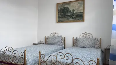 Un ou plusieurs lits dans un hébergement de l'établissement Maison dans un endroit calme