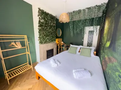 Un ou plusieurs lits dans un hébergement de l'établissement Jungle Urbain- Sauna - Ciné - Hamac - Hyper centre