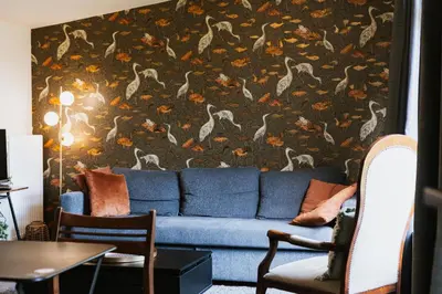 Coin salon dans l'établissement Appartement les Glycines - Accès Piscine