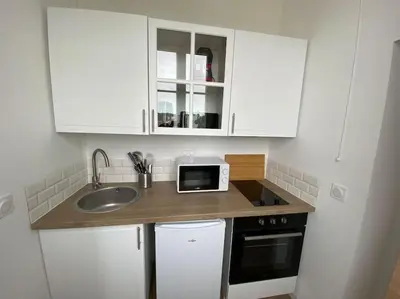 Cuisine ou kitchenette dans l'établissement La Perle Bleue