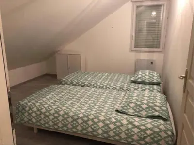 Un ou plusieurs lits dans un hébergement de l'établissement Vue sur Mer