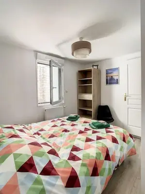 Un ou plusieurs lits dans un hébergement de l'établissement Grande Maison Cosy Terrasse Parking Gare 8 Pers
