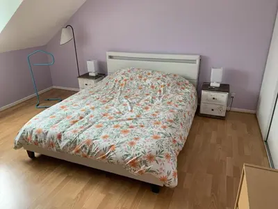 Un ou plusieurs lits dans un hébergement de l'établissement Chambres d'hôtes dans le Val d'Oise