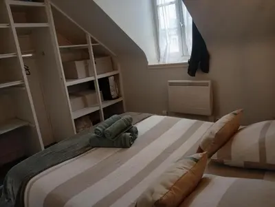Un ou plusieurs lits dans un hébergement de l'établissement La Cabane du Pêcheur