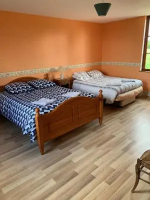 Un ou plusieurs lits dans un hébergement de l'établissement Chambres d'hôtes
