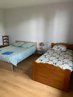 Un ou plusieurs lits dans un hébergement de l'établissement Chambres d'hôtes