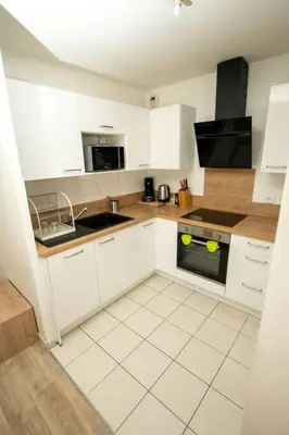 Cuisine ou kitchenette dans l'établissement T2 au calme proche gare, parking privé