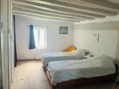 Un ou plusieurs lits dans un hébergement de l'établissement Maison en Colombage