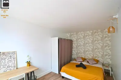 Un ou plusieurs lits dans un hébergement de l'établissement Amiens Chic - Baby Foot&Élégance