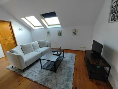 Télévision ou salle de divertissement dans l'établissement Cosy appartement 2 chambres