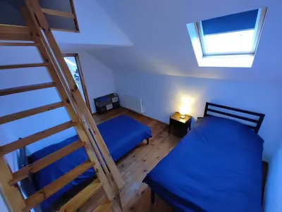 Un ou plusieurs lits dans un hébergement de l'établissement Cosy appartement 2 chambres