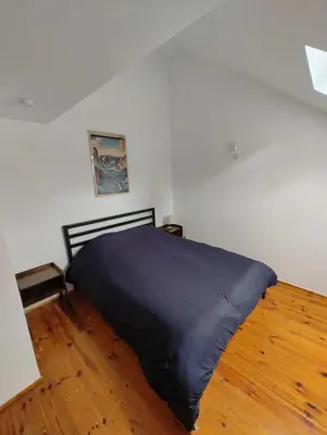 Un ou plusieurs lits dans un hébergement de l'établissement Cosy appartement 2 chambres