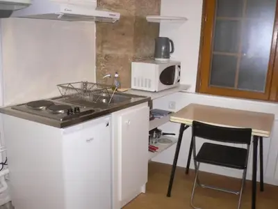 Cuisine ou kitchenette dans l'établissement En plein centre historique et piétonnier