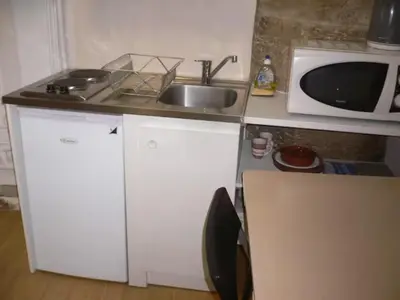 Cuisine ou kitchenette dans l'établissement En plein centre historique et piétonnier